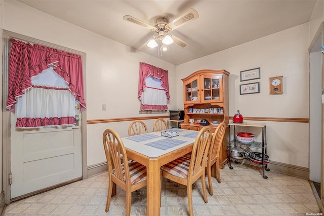 dining space featuring ceiling fan