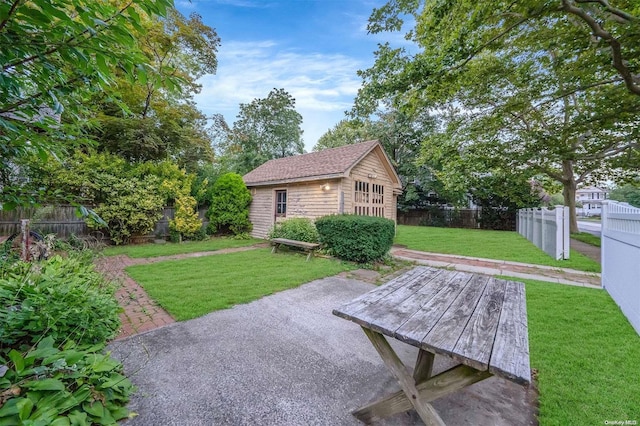 view of patio with an outbuilding