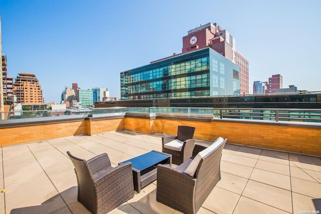 view of patio featuring a balcony