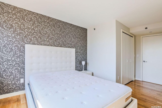 bedroom with wood-type flooring