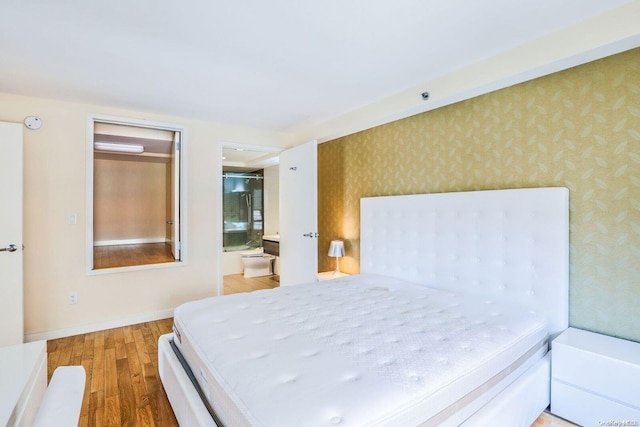 bedroom with wood-type flooring