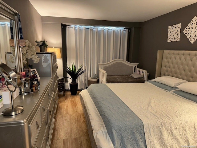 bedroom featuring light hardwood / wood-style flooring