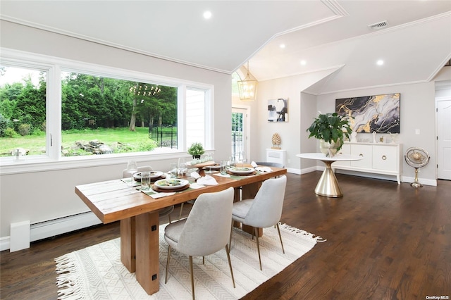 dining area with crown molding, plenty of natural light, dark hardwood / wood-style floors, and a baseboard heating unit