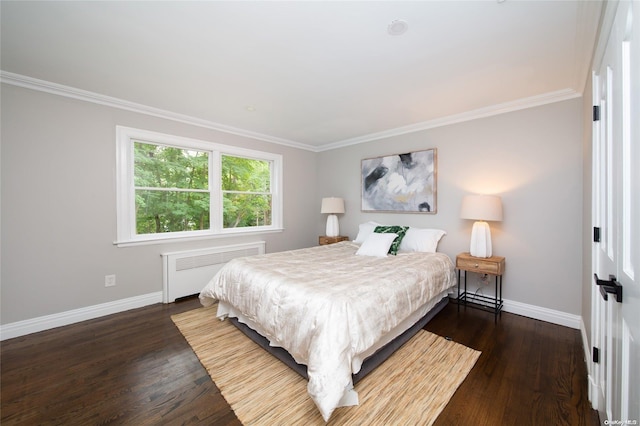 bedroom featuring dark hardwood / wood-style floors, crown molding, and radiator