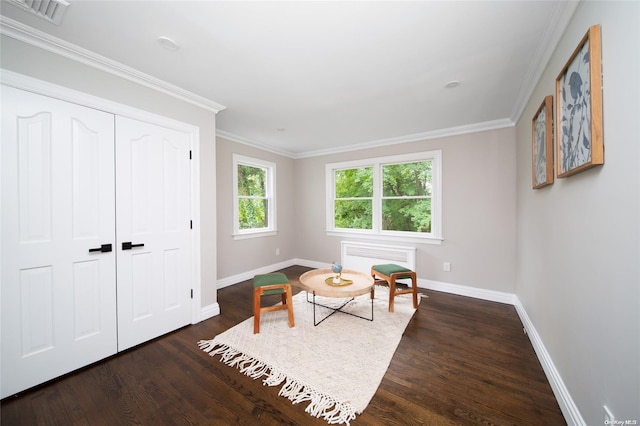 sitting room featuring dark hardwood / wood-style flooring and crown molding