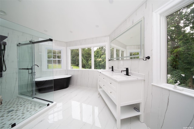 bathroom with vanity and separate shower and tub