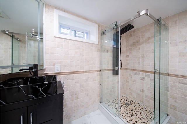 bathroom with sink and a shower with shower door