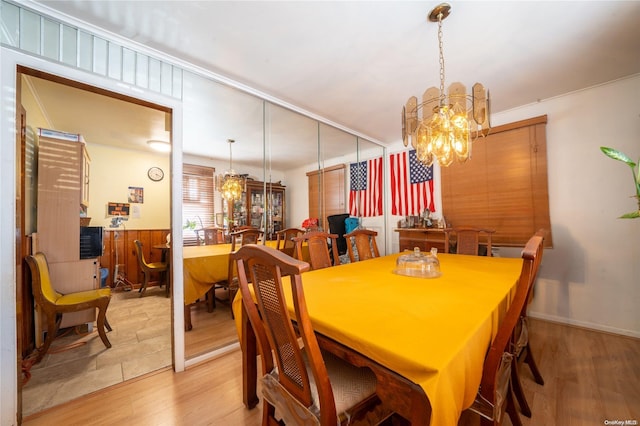 dining area featuring a chandelier and light hardwood / wood-style flooring