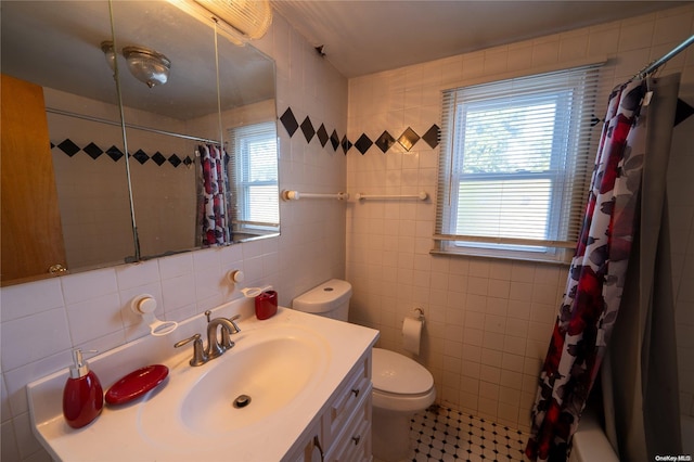 bathroom featuring vanity, decorative backsplash, and tile walls