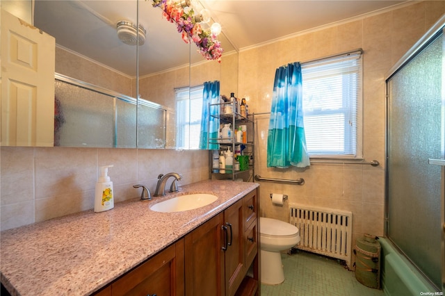 full bathroom with decorative backsplash, vanity, tile walls, radiator heating unit, and toilet