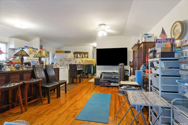 interior space with light hardwood / wood-style flooring and lofted ceiling