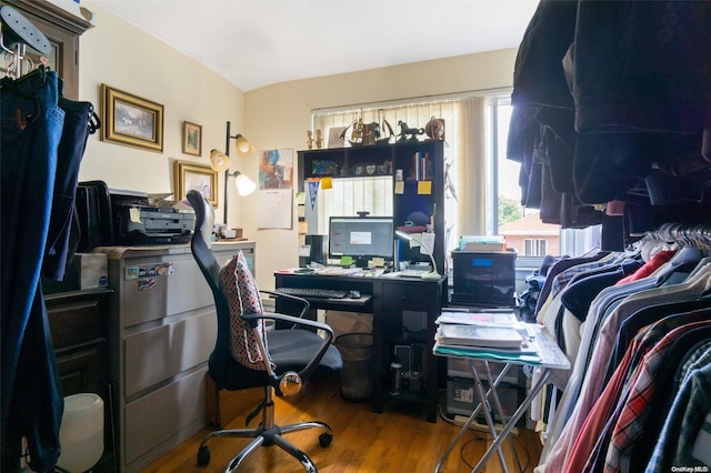 office space with wood-type flooring