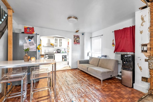 living room featuring parquet floors