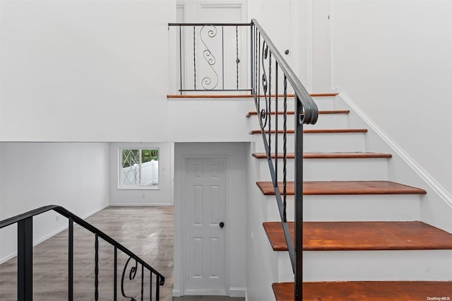 stairs featuring hardwood / wood-style flooring