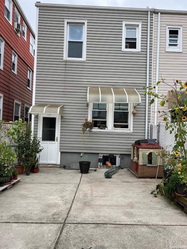 back of house with a patio