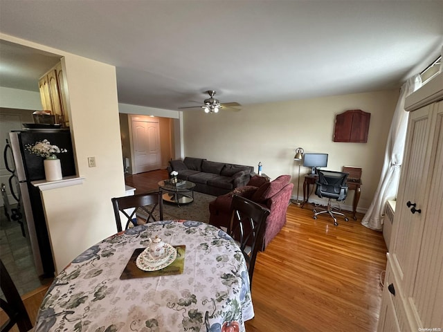 dining room featuring ceiling fan and hardwood / wood-style flooring