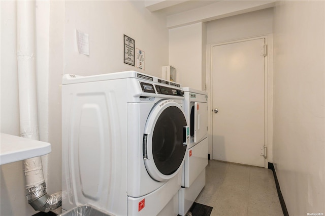 washroom with washer and dryer