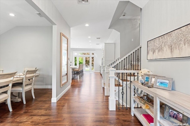 foyer entrance with lofted ceiling, french doors, and dark hardwood / wood-style flooring