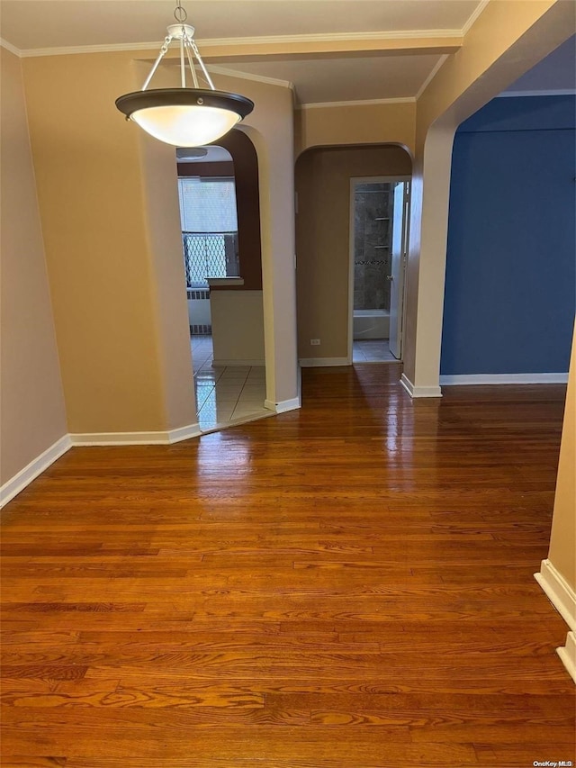 interior space featuring crown molding and hardwood / wood-style floors