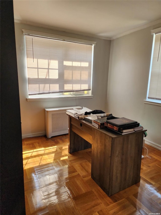 office space featuring radiator heating unit, light parquet flooring, and ornamental molding