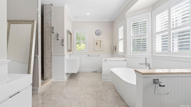 bathroom with vanity, crown molding, shower with separate bathtub, and a wealth of natural light