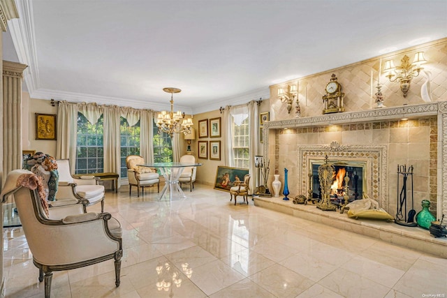 living room featuring a chandelier, tile walls, ornamental molding, and a tiled fireplace