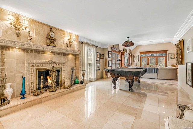 rec room featuring a fireplace, crown molding, pool table, and tile walls