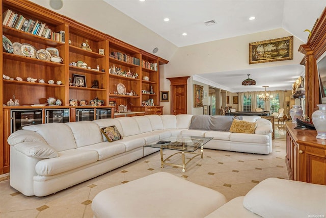 living room featuring a chandelier and beverage cooler