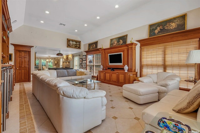 living room with high vaulted ceiling and light tile patterned flooring