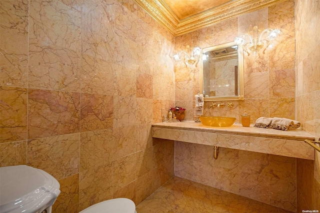 bathroom with toilet, tile walls, and crown molding