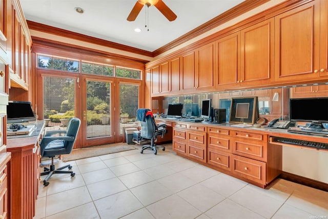 tiled home office featuring crown molding, ceiling fan, and built in desk