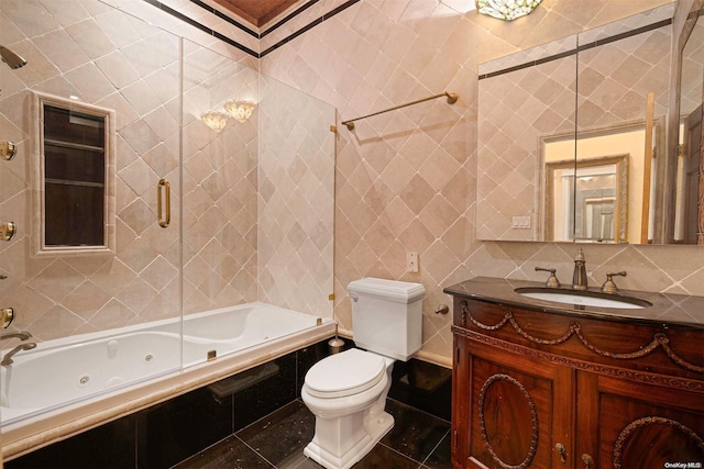 full bathroom featuring vanity, tile patterned flooring, toilet, tile walls, and tub / shower combination