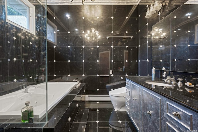 bathroom featuring vanity, tile patterned flooring, toilet, tile walls, and tiled tub