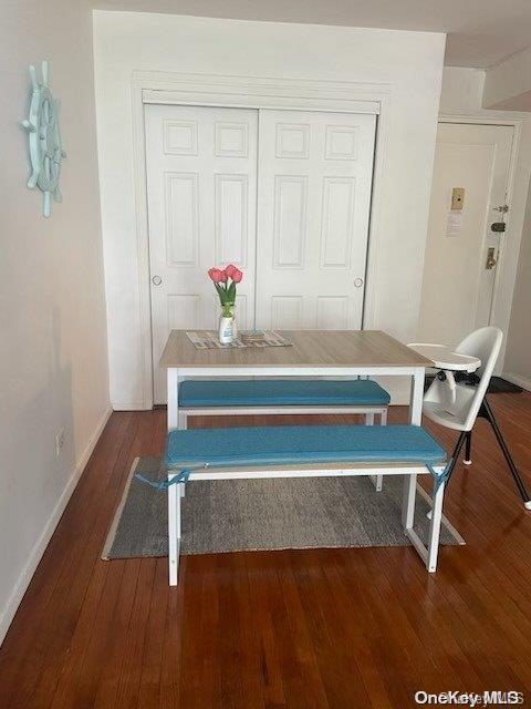 detailed view of baseboards and wood finished floors