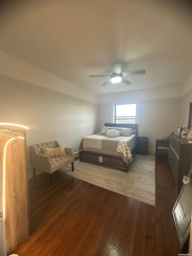 bedroom featuring dark hardwood / wood-style flooring and ceiling fan