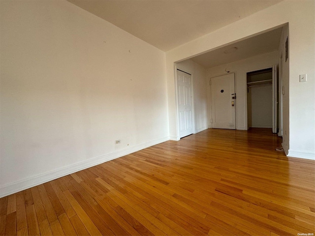 empty room featuring wood-type flooring