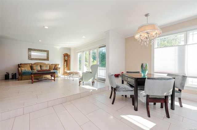 dining room with an inviting chandelier, ornamental molding, and light tile patterned flooring