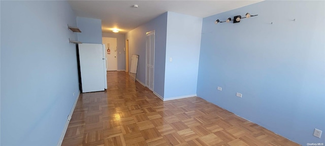 corridor with light parquet floors