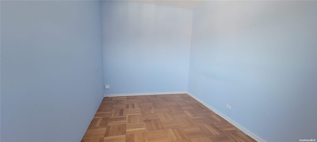 spare room with parquet floors