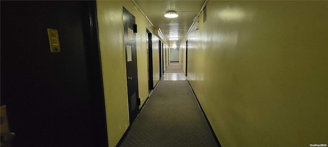 hall featuring carpet