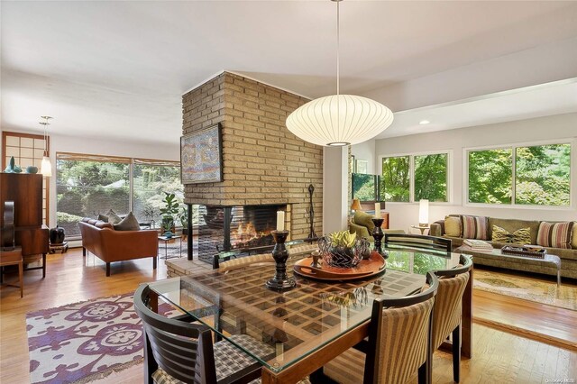 3 Pennington Dr, Huntington, NY 11743 - dining space featuring hardwood / wood-style floors and a fireplace