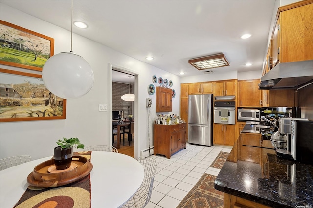 3 Pennington Dr, Huntington, NY 11743 - kitchen with stainless steel appliances, under cabinet range hood, brown cabinets, a baseboard radiator, and light tile patterned floors