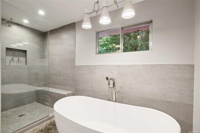 3 Pennington Dr, Huntington, NY 11743 - full bath with a soaking tub, tile walls, a tile shower, and recessed lighting