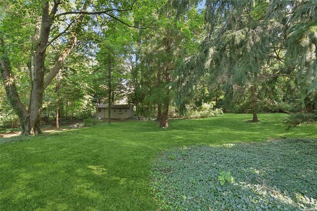 3 Pennington Dr, Huntington, NY 11743 - view of grassy yard with a view of trees
