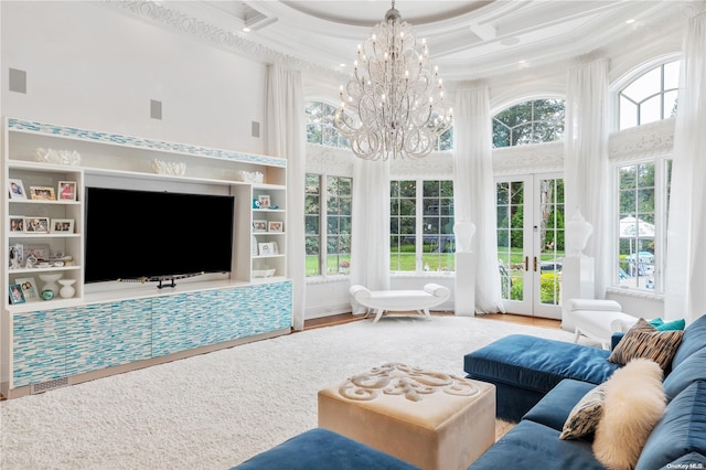 living room featuring french doors, a towering ceiling, hardwood / wood-style floors, and coffered ceiling