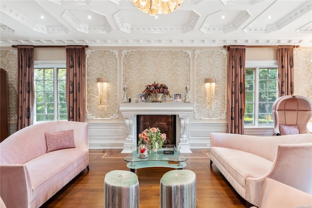 sitting room with dark hardwood / wood-style flooring, a wealth of natural light, crown molding, and a high end fireplace