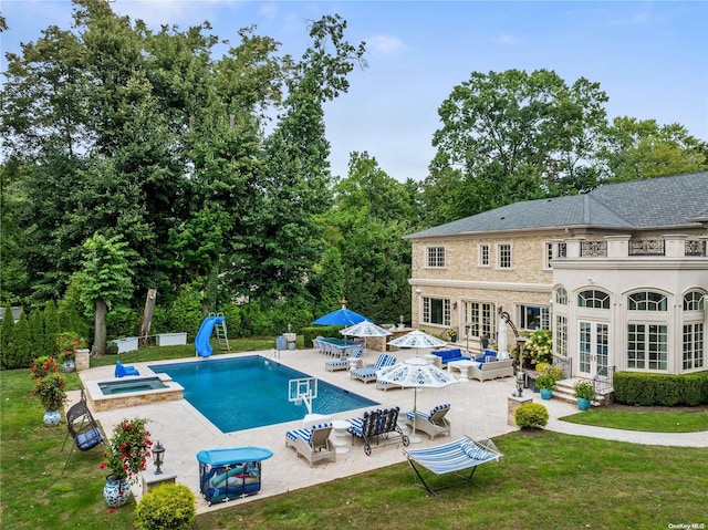 view of swimming pool with an in ground hot tub, french doors, an outdoor hangout area, a yard, and a patio