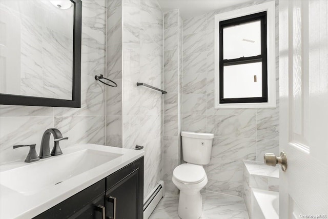 bathroom with toilet, vanity, tile walls, and a baseboard heating unit