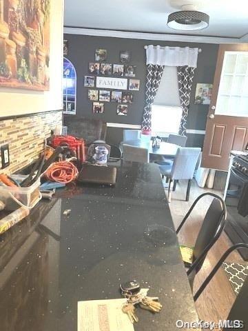 dining area featuring crown molding