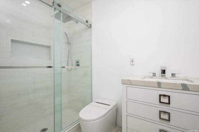 bathroom featuring an enclosed shower, vanity, and toilet